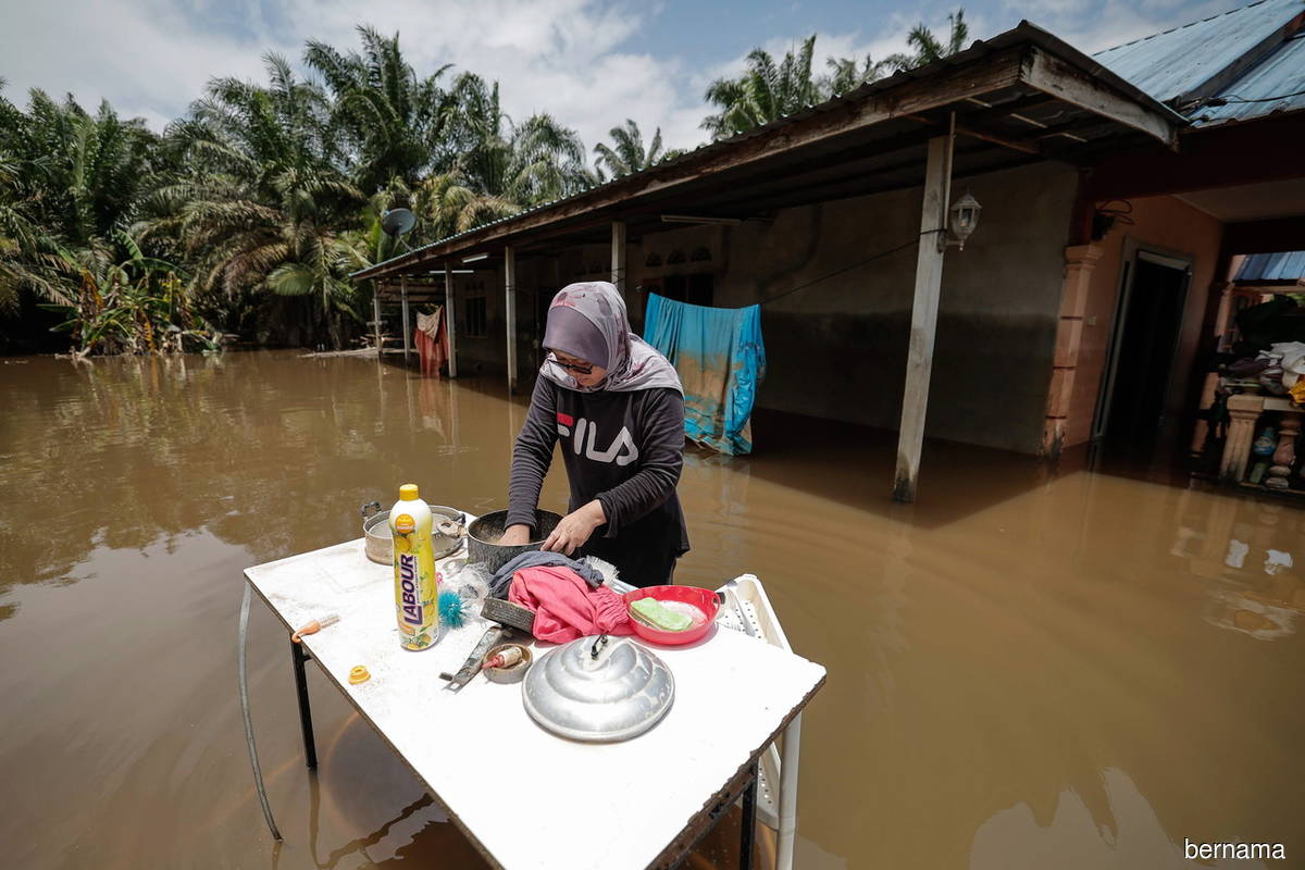 Post-flood clean-up work in Yong Peng, Batu Pahat, Johor on Monday (March 13).